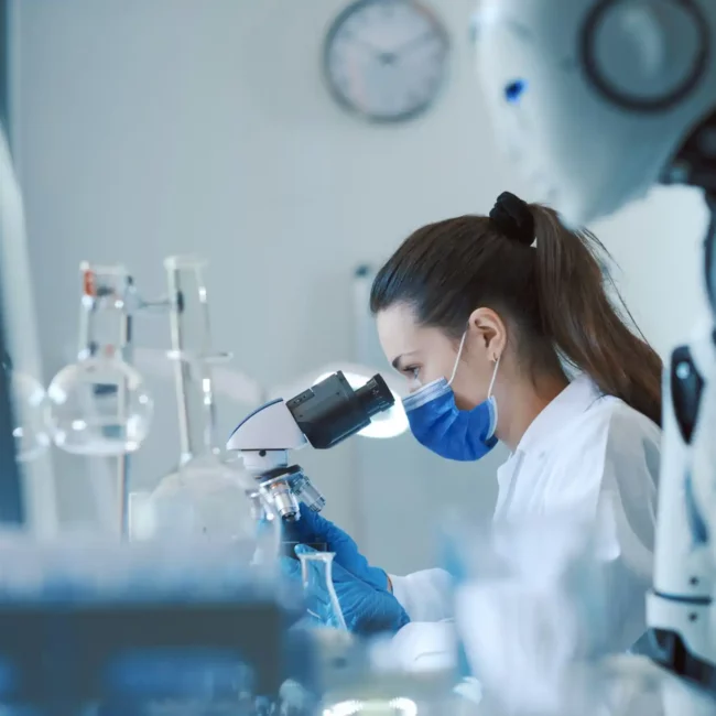 Scientist and humanoid AI robot in the science lab