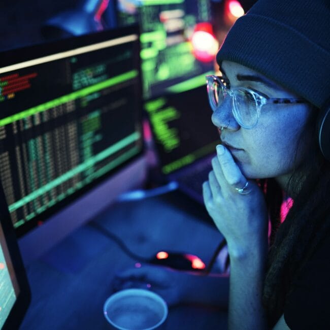 Woman, computer and hacker with music headphones and programming for cybersecurity. Thinking, radio